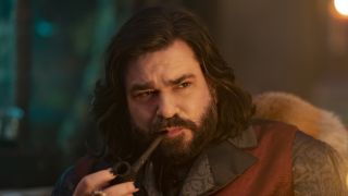 Laszlo puffing on a cigar in What We Do In The Shadows Season 5