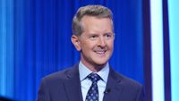 Ken Jennings in navy jacket hosting Celebrity Jeopardy